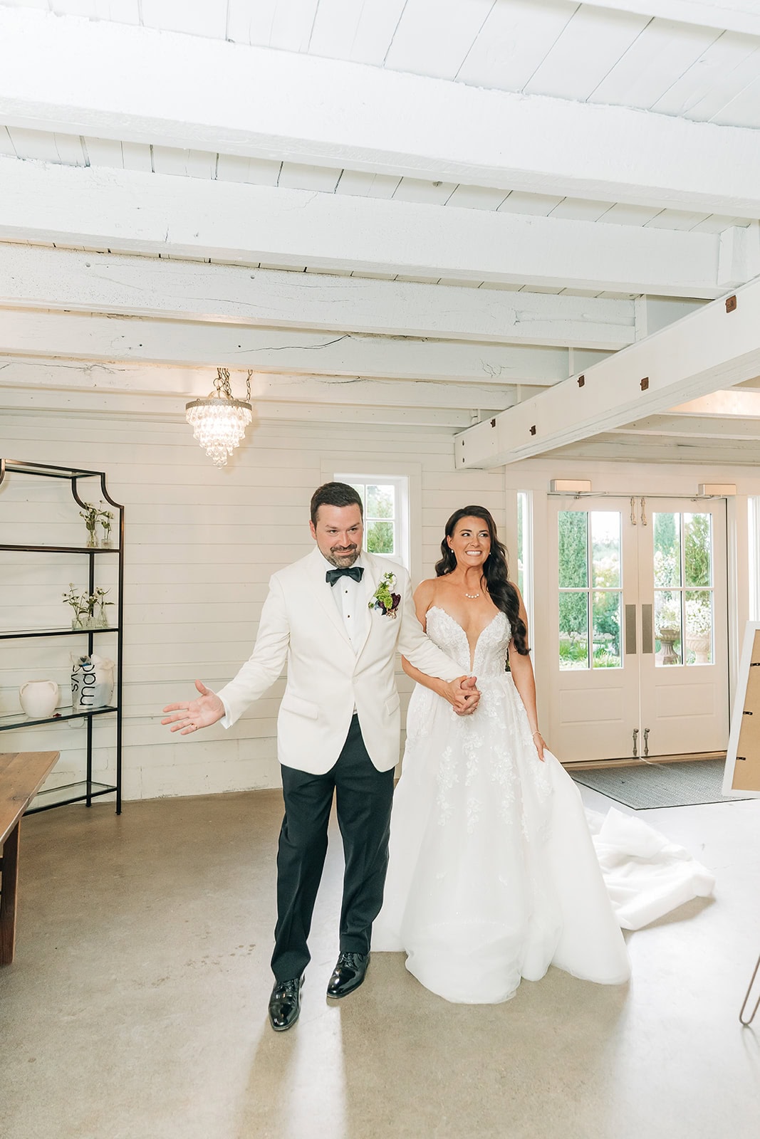 bride and groom entering wedding reception at redeemed farm, mn