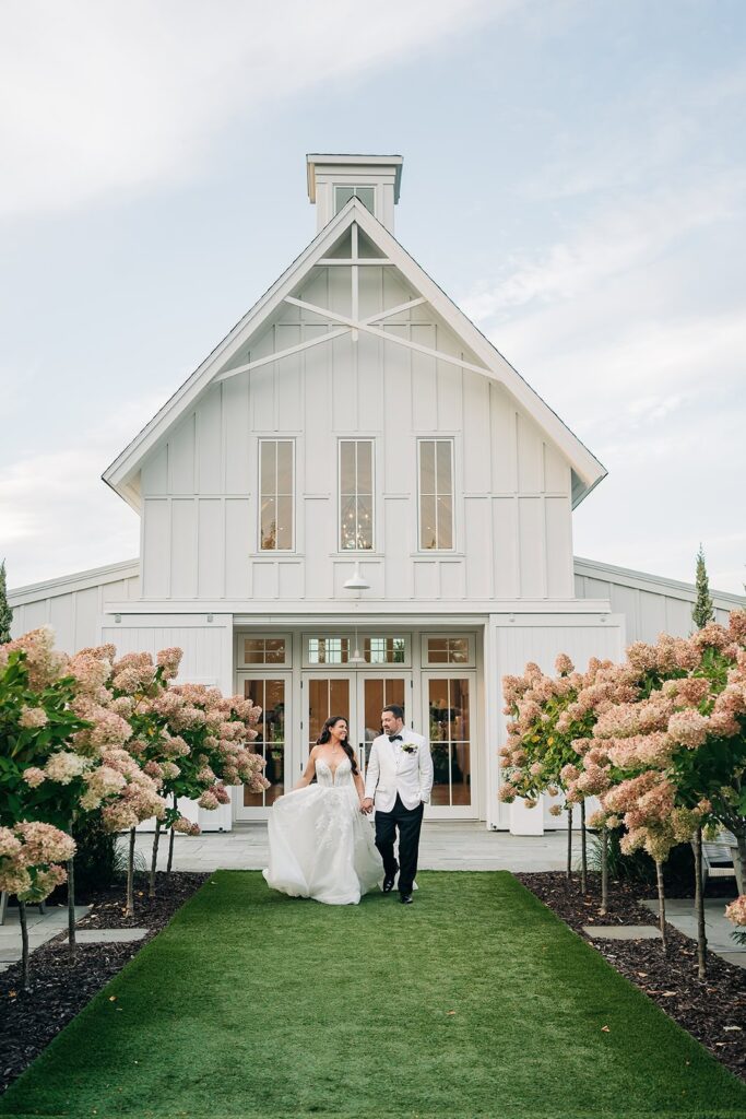 wedding portraits in front of redeemed farm, mn