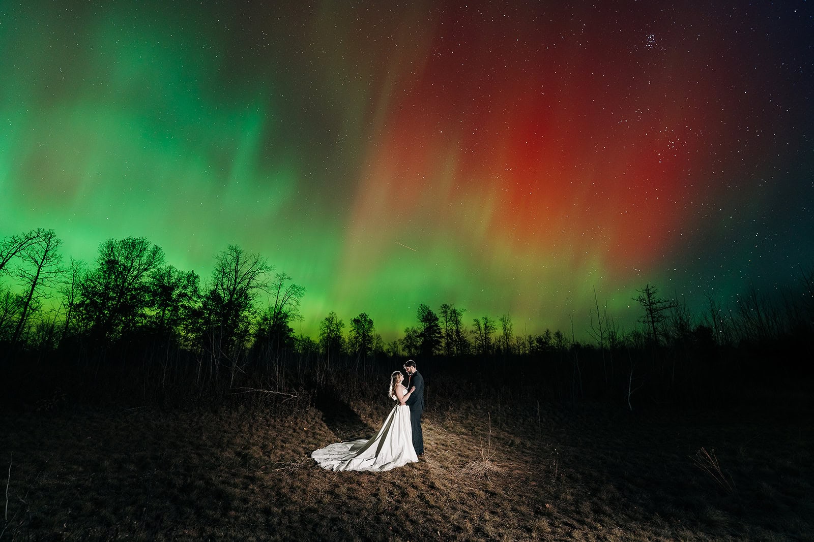 Romantic couple portrait on Minnesota’s North Shore with Northern Lights overhead
