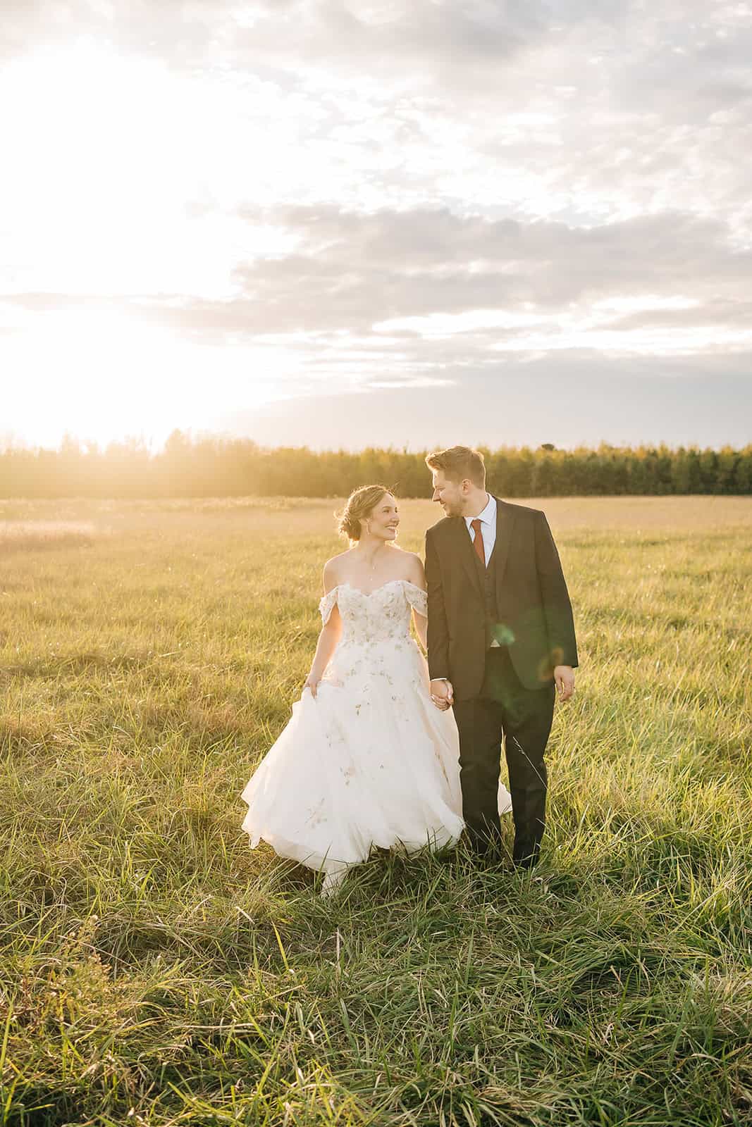 Bride and groom sunset portraits at Ivory North with open fields