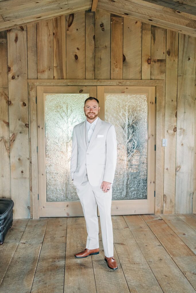 Groom getting ready moments during wedding day in Rush City MN