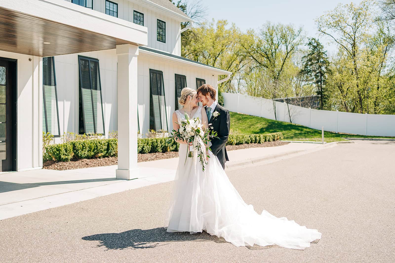 bride and groom taking photos outside at hutton house wedding venue