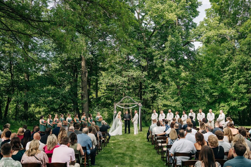 Guests seated for outdoor wedding ceremony at Creekside Farm