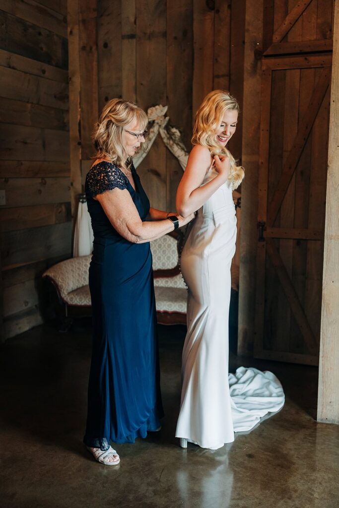 Wedding morning moments in bridal suite at barn wedding venue in Rush City MN