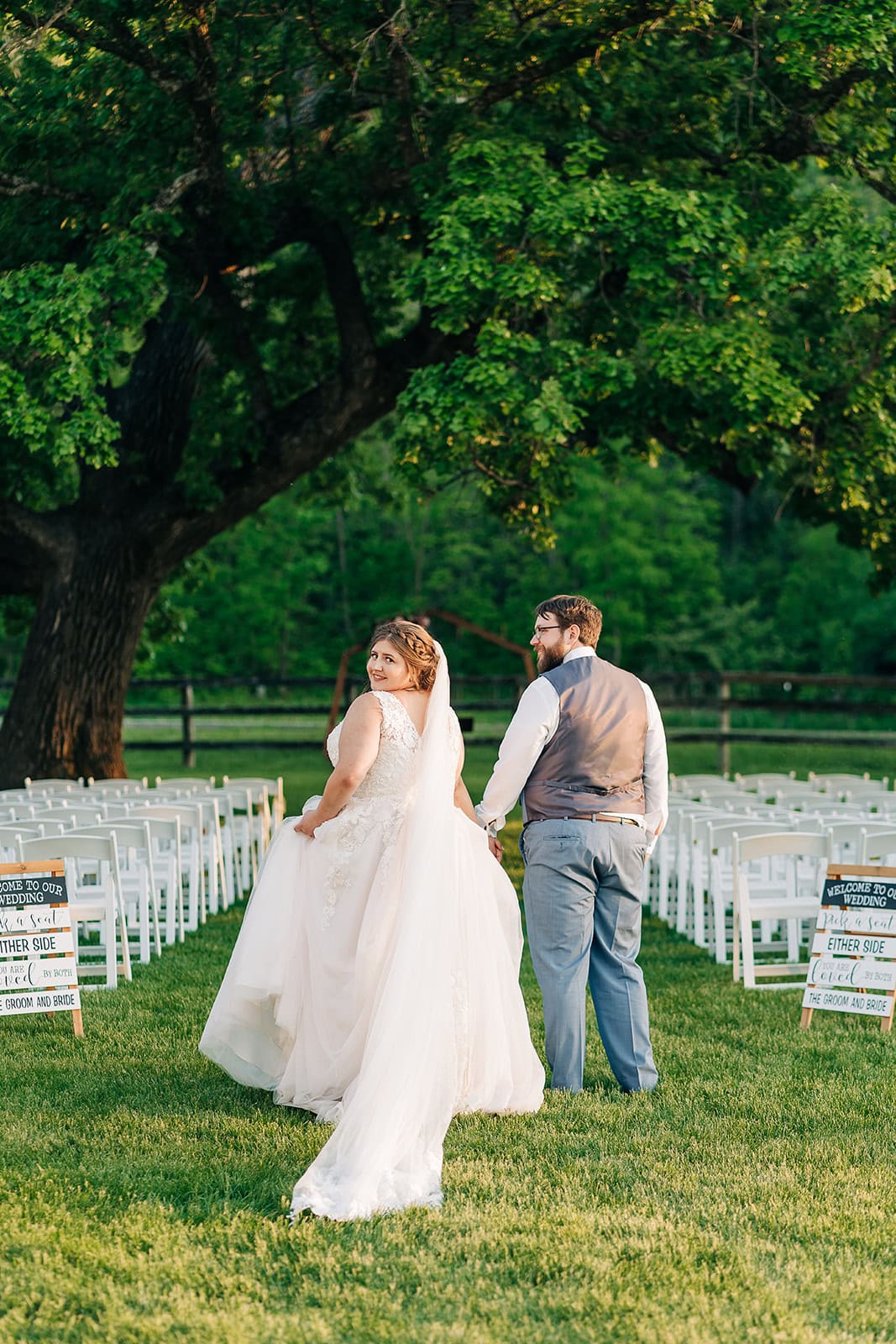 bride and groom under Bur Oak at sunset