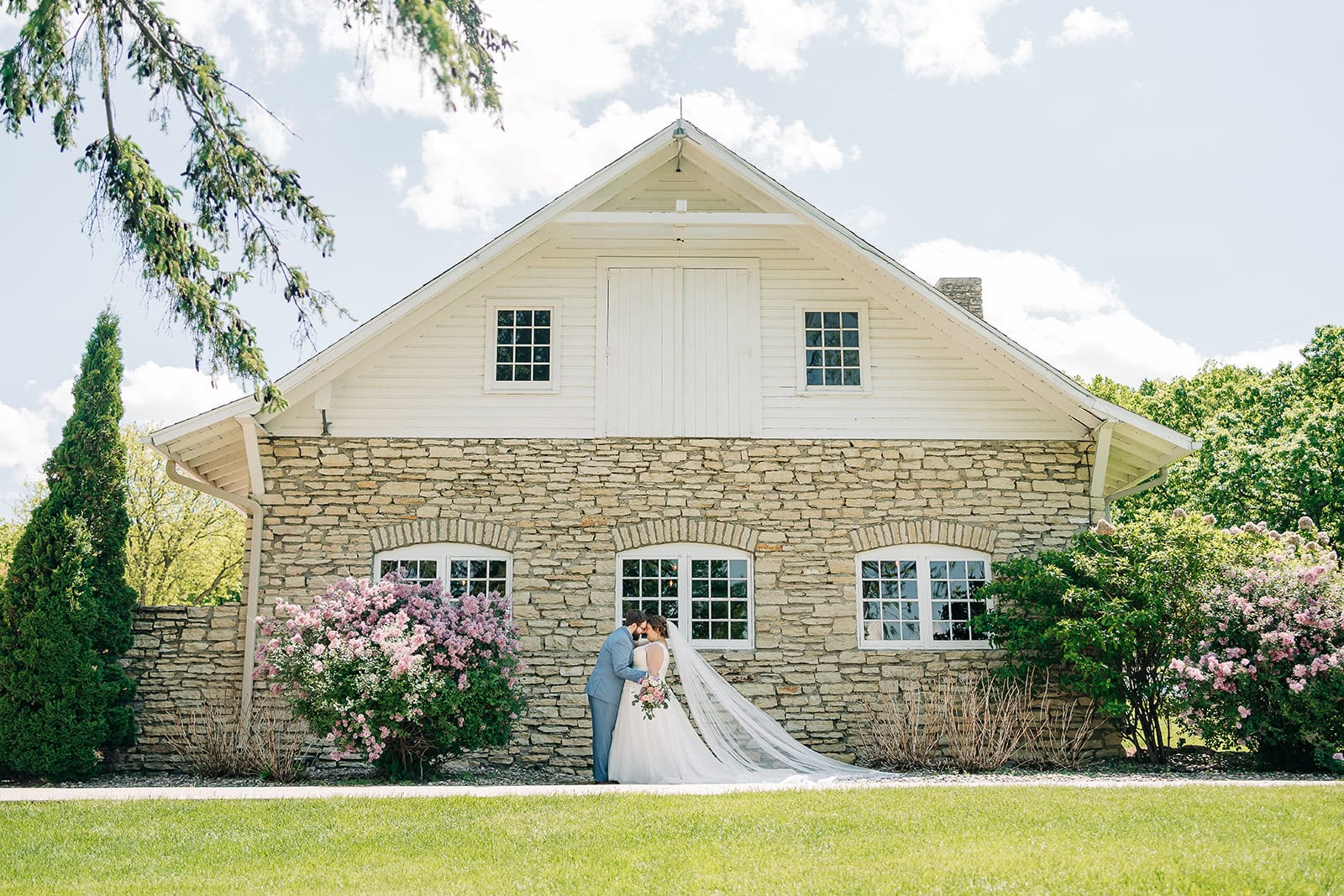 couple portrait near historic stone architecture in Minnesota